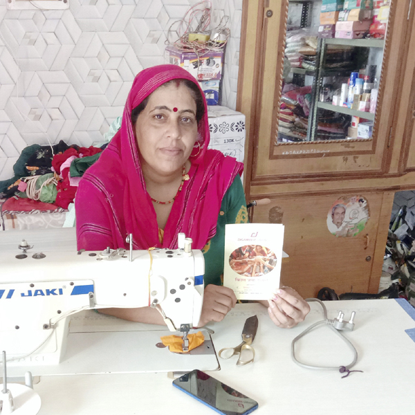Sushila Devi at her sewing machine